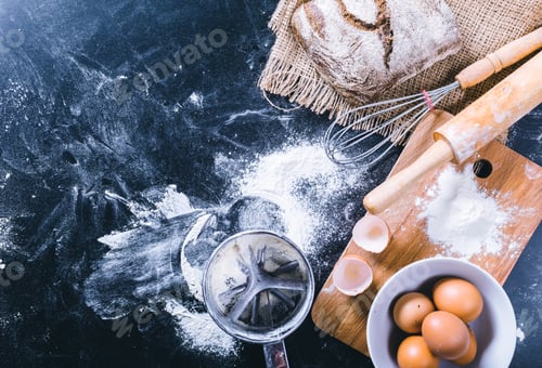 Preview: Preparing ingredients for baking bread and cooking eggs on a kitchen counter