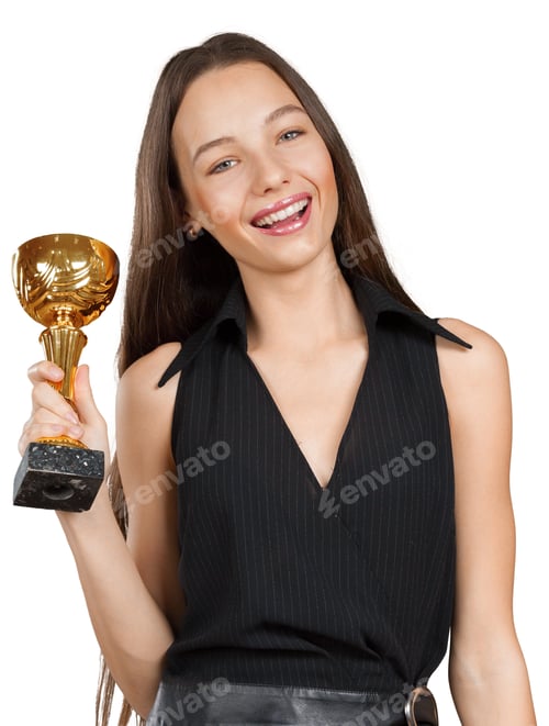 Preview: Winning moment with trophy held by a young woman in a black outfit inside a studio setting