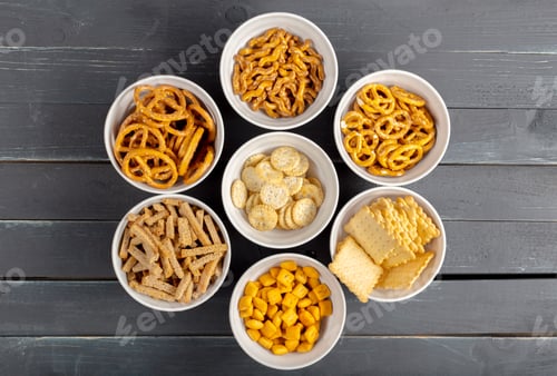 Preview: Snacks arranged in bowls on a wooden table for a gathering or party setting