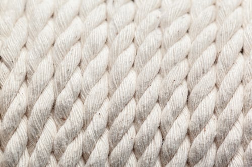 Preview: White ropes laid out in neat rows on a flat surface for textile projects and crafts