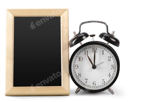 Preview: Clock and empty frame sit on table showing the time as five minutes past ten