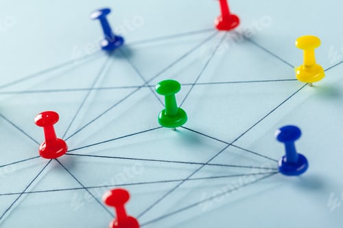 Preview: Connections shown with colored pins on paper with blue background during daylight hours