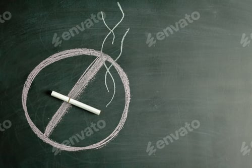 Preview: Circle and line drawn with chalk on blackboard showing no smoking symbol at school