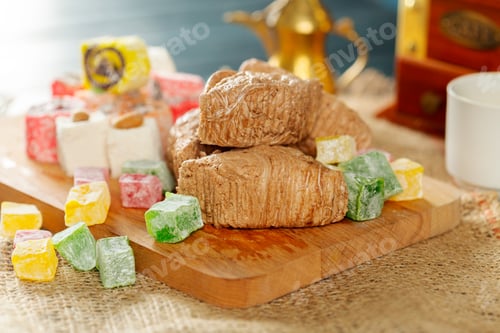Preview: People enjoy sweets and snacks on a wooden board during a gathering in a home kitchen