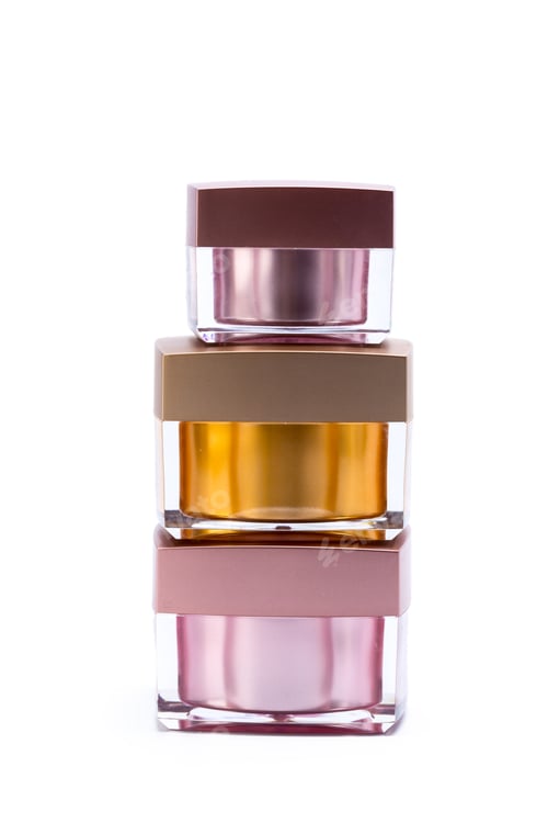 Preview: Stacked jars with colorful lids placed in a simple arrangement for display and storage