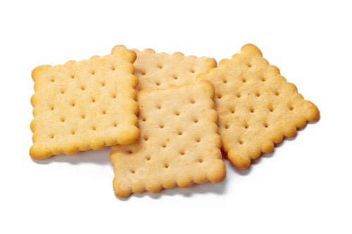 Preview: Four square crackers arranged neatly on a white background in plain style