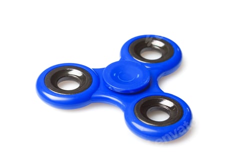 Preview: Fidget spinner with three sections placed on a white surface