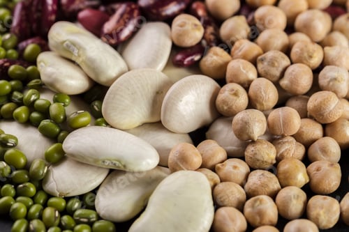 Preview: Decorative display of various dried beans and legumes in close view on a flat surface