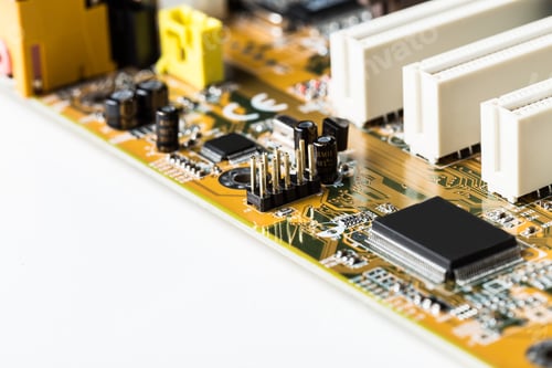 Preview: Details of a printed circuit board with electronic components in a close-up view from a side angle