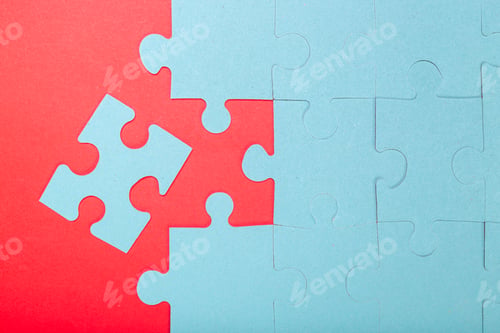 Preview: Puzzle piece sits next to its place on a red and blue background