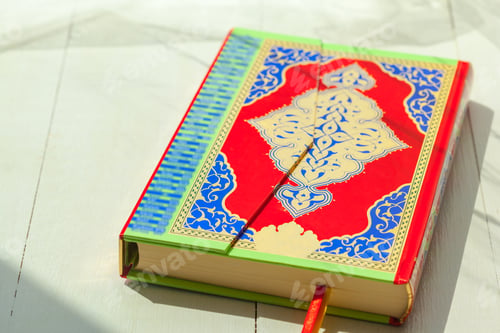 Preview: Colorful journal lays open on a table in bright sunlight during the afternoon