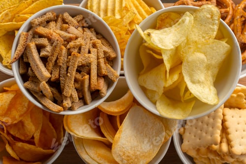 Preview: Variety of snack foods in bowls on a table for a casual gathering