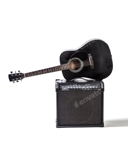 Preview: Guitar rests on amplifier in indoor setting during daylight hour