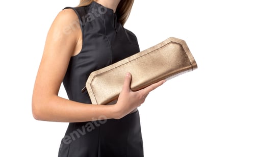 Preview: Woman holds shiny gold clutch purse in modern fashion setting