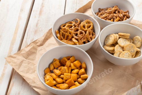 Preview: Snack bowls filled with different types of treats on a table during a casual gathering