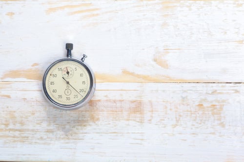 Preview: Vintage stopwatch placed on a wooden table during the day with good lighting