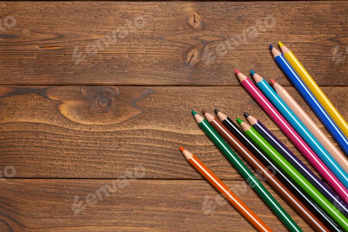 Preview: Colorful pencils arranged on wooden table in a creative workspace