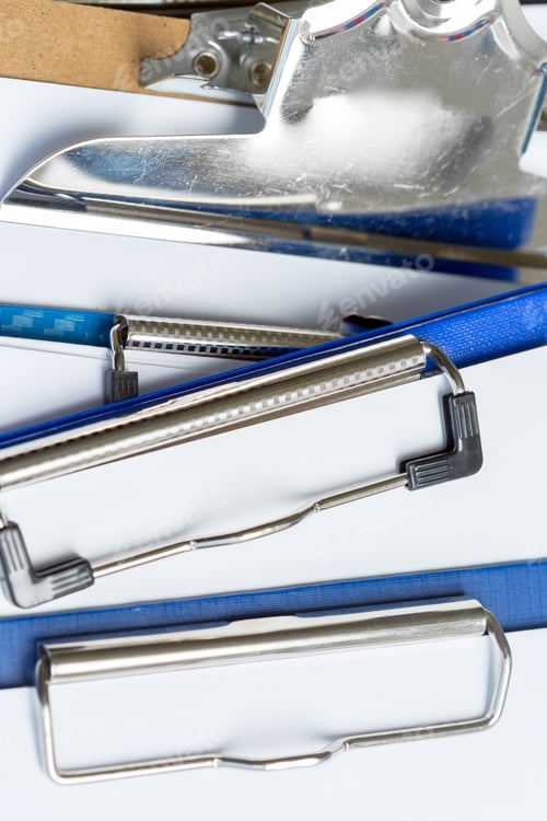 Preview: Different types of clipboards arranged on a flat surface in an office setting