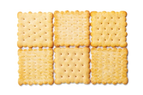Preview: Square crackers arranged in a pattern on a plain white background for snack preparation