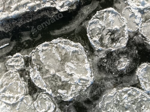 Preview: Top down view of floes on river in winter.