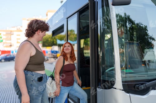 Preview: Women entering bus at stop, friends traveling together enjoying public transportation in city