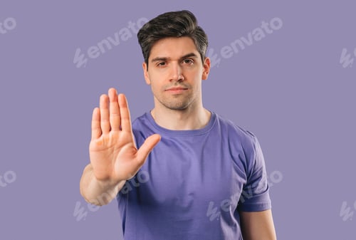 Preview: Uninterested Handsome Mature Man Disapproving With Stop Hand Sign. Dont Play