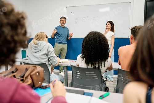 Preview: Professor teaching math class discussing equation with students