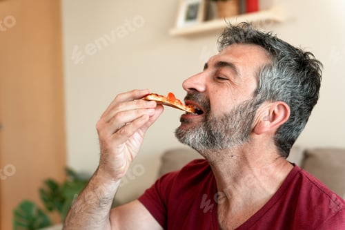 Preview: Man enjoying eating warm fresh pizza slice