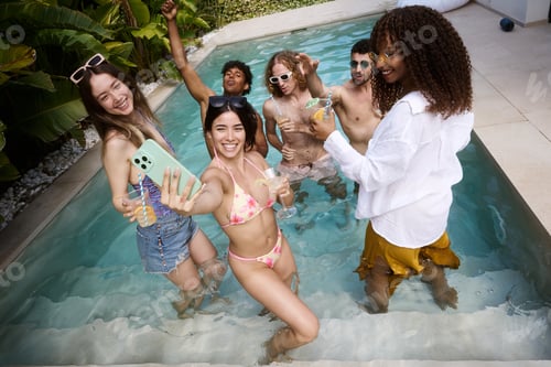 Preview: Diverse friends taking selfie enjoying summer pool party