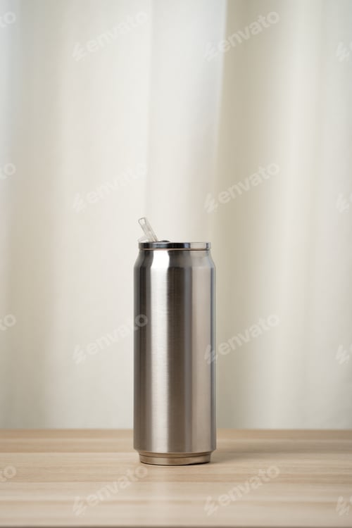 Preview: Stainless Steel Tumbler With Straw On Wooden Table Slim Insulated Reusable Drink Can