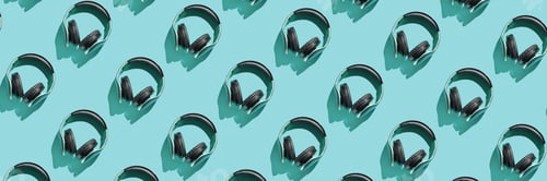 Preview: Many same headphones on bright background. Modern music concept