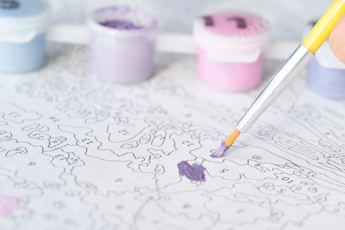 Preview: Close-up of paint by numbers canvas with purple brushstroke and paint pots