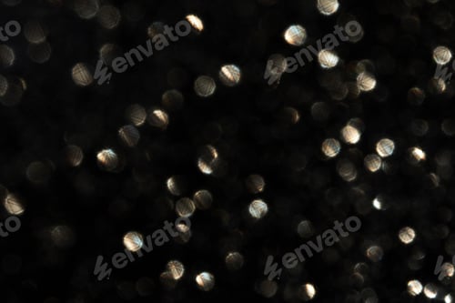 Preview: Numerous Small Bright Bokeh Circles Scattered Across Dark Backdrop Creating Soft Out Of Focus Light