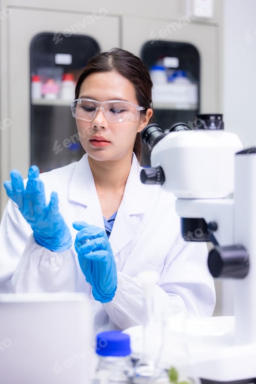 Preview: Asian woman scientist confident using microscope at laboratory, Scientist working with sample in lab