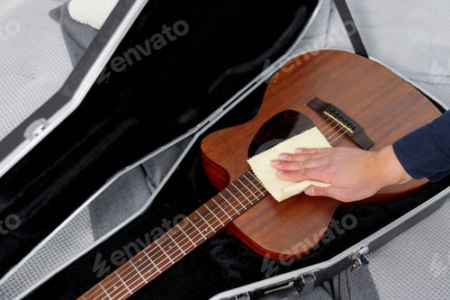 Preview: Hand cleaning acoustic guitar body with microfiber cloth