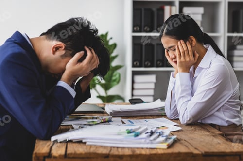 Preview: Business people feeling stressed and frustrated from work in office. Team of business people is havi
