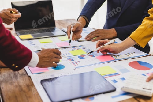 Preview: Businessman analyzing financial data with chart and graph. Business team collaborates in office, ana