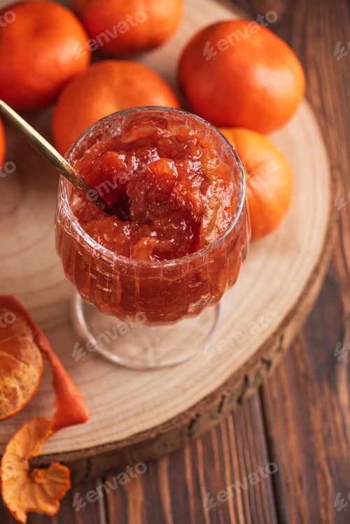 Preview: Fresh Tangerines with Jam Glass on wooden Background.