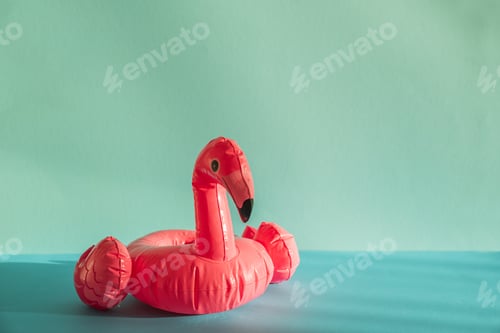 Preview: Pink Flamingo Shaped Pool Float on Turquoise Water