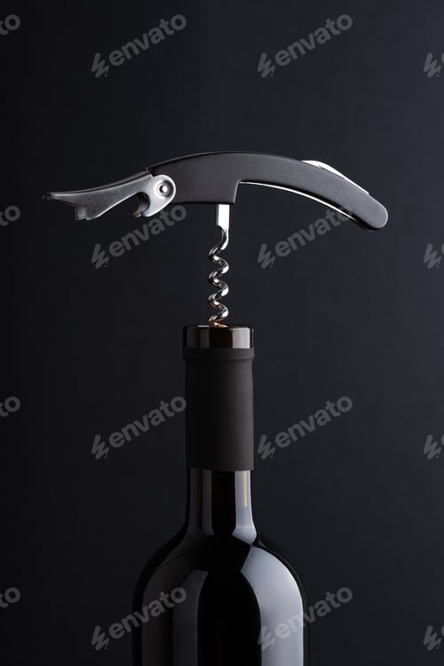 Preview: Corkscrew opening a bottle of red wine, starting to pull cork