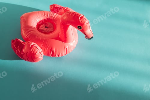 Preview: Pink Flamingo Shaped Pool Float on Turquoise Water