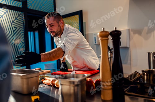 Preview: Chef in the kitchen holding a cooking class.