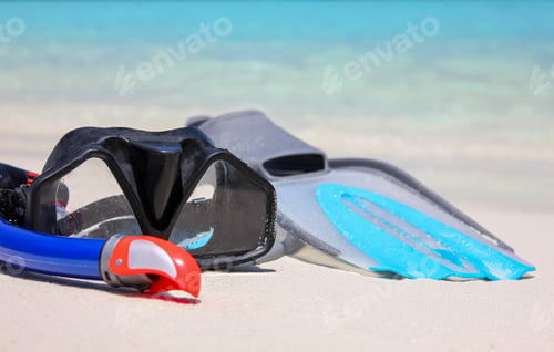 Preview: Snorkeling mask and fins on the tropical beach. Summer vacation concept.
