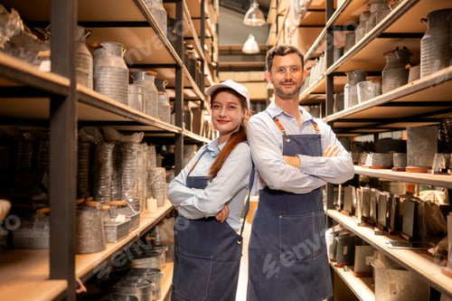 Preview: Confident small business team standing in a warehouse