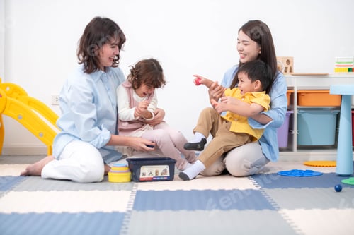 Preview: Teachers and parent playing joyfully with children