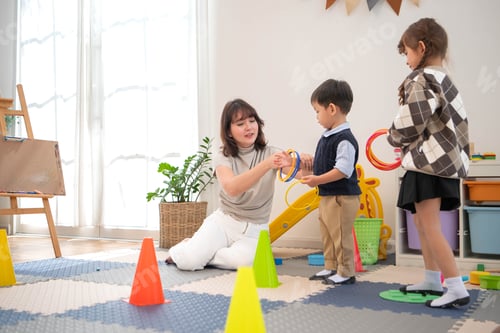 Preview: Mother teaching her child how to play a ring toss game properly