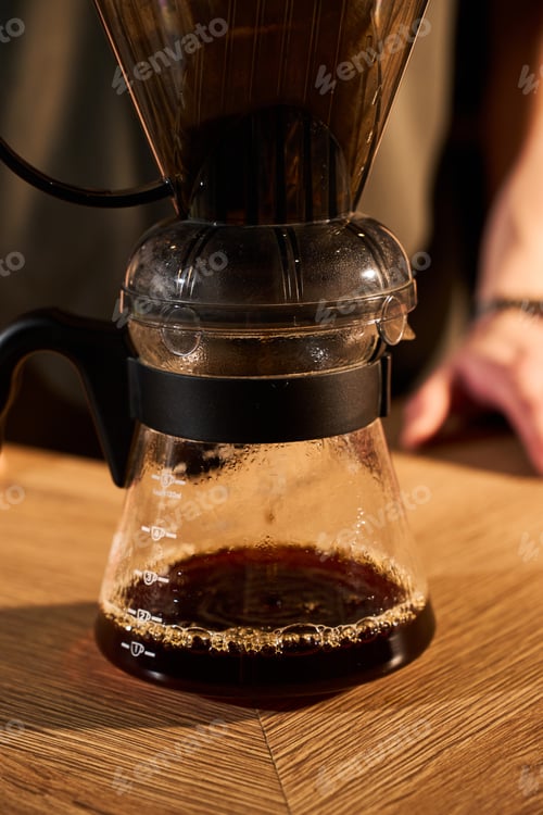 Preview: Filter coffee brewing with hot water from gooseneck kettle into Clever Dripper.