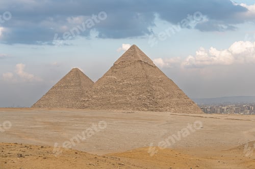 Preview: Great Pyramids of Giza in Egypt Ancient Wonders and Desert Landscape Beneath a Cloudy Sky