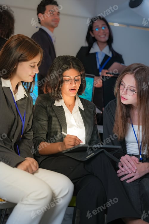 Preview: Confident diverse female AI security team looking forward with vision. Multiethnic women in technolo