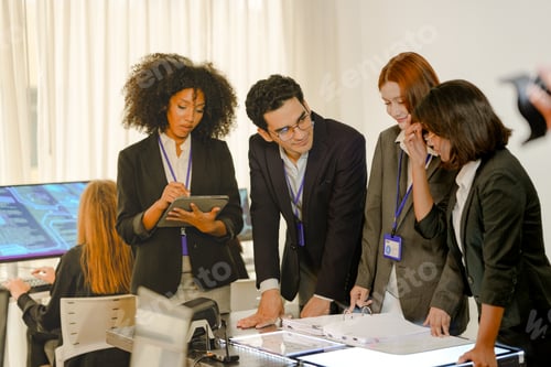Preview: Multiethnic AI security squad analyzing threat intelligence in a bright SOC. Diverse IT experts coll